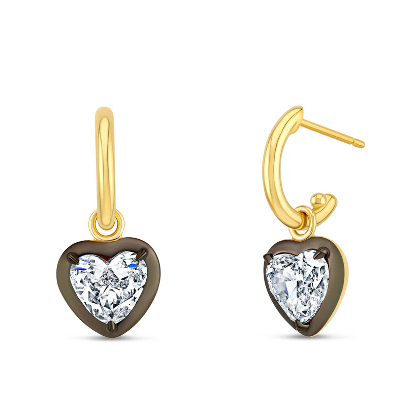 Heart-shaped earrings with clear gemstones on a white background
