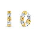 Gold and silver hoop earrings with clear gemstones on a white background