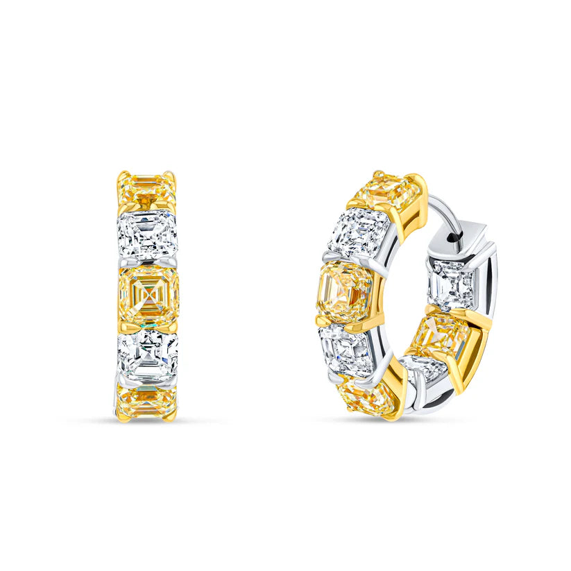 Gold and silver hoop earrings with clear gemstones on a white background