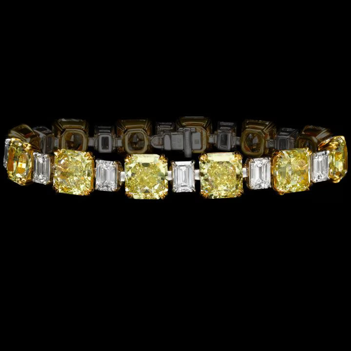 GLOWING RADIANCE DIAMOND BRACELET, FANCY YELLOW DIAMONDS, EACH WEIGHING OVER 3 CARATS D TO F COLOR, EMERALD-CUT DIAMONDS