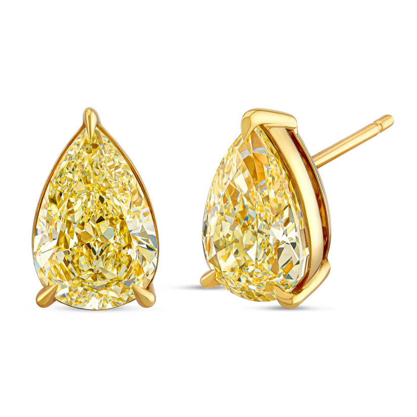 Gold teardrop-shaped earrings with clear gemstones on a white background