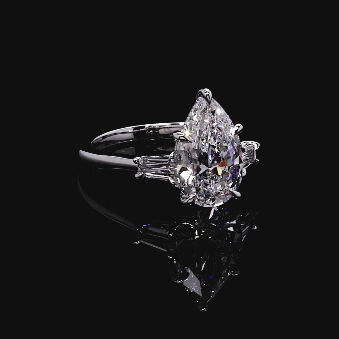 PEAR CUT THREE STONE RING