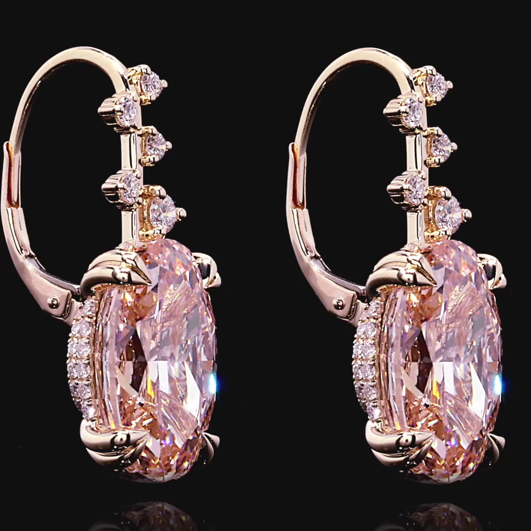 Elevate your collection with these exquisite high jewelry earrings, crafted in 18k rose gold to complement the warmth of premium pink diamonds. Featuring 82 stones totaling approximately 17.38 carats, this pair combines oval and round brilliant cuts for dynamic sparkle and refined elegance. Each stone meets exceptional standards—FIP/VS1 and F+/VS1+ clarity grades ensure lasting brilliance. Secured with reliable latch backs for everyday luxury wear. A timeless investment piece that captures light and admirat