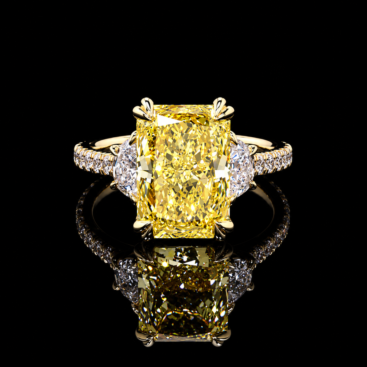 6.97 CT yellow radiant three-stone diamond ring with 6.10 CT center and pear side diamonds by Dan Mor Diamonds