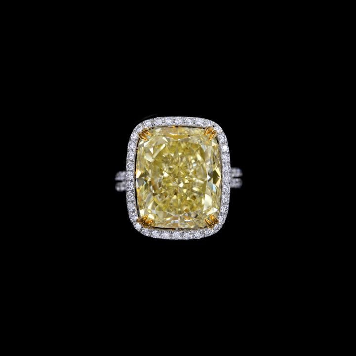 A SOLITARY FANCY YELLOW STATEMENT 14.17 CARAT FANCY LIGHT YELLOW MAIN STONE