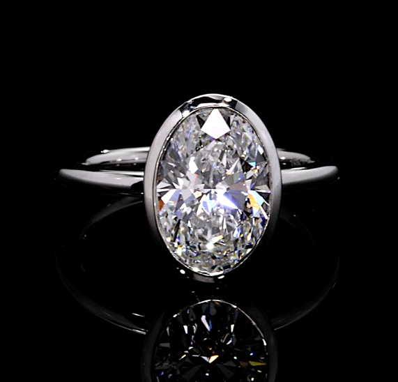 3.02 CT oval bezel lab-grown diamond ring with 2.95 CT E VS1 center by Dan Mor Diamonds