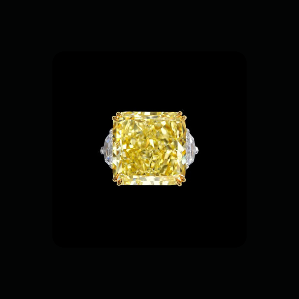 Over 40 CT fancy yellow diamond statement ring with white diamond side accents by Dan Mor Diamonds