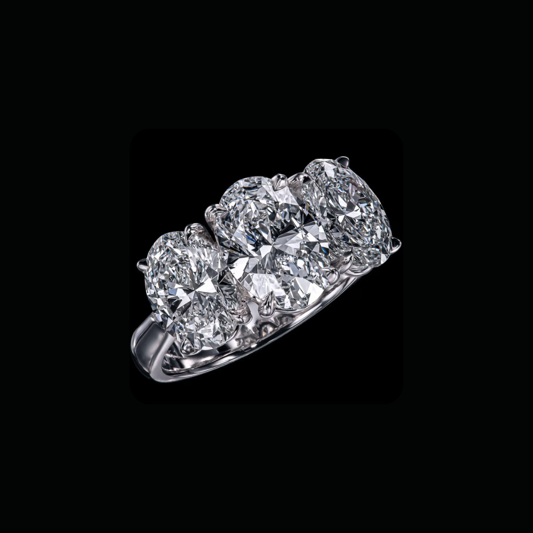 6.15 CT oval three stone diamond anniversary ring with E VVS2 center diamond by Dan Mor Diamonds