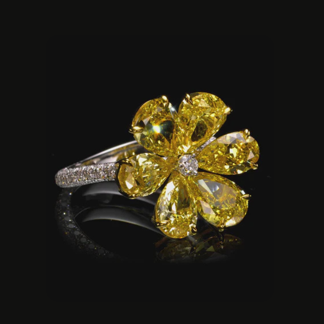 total 6.75 carat fancy vivid yellow pear diamond