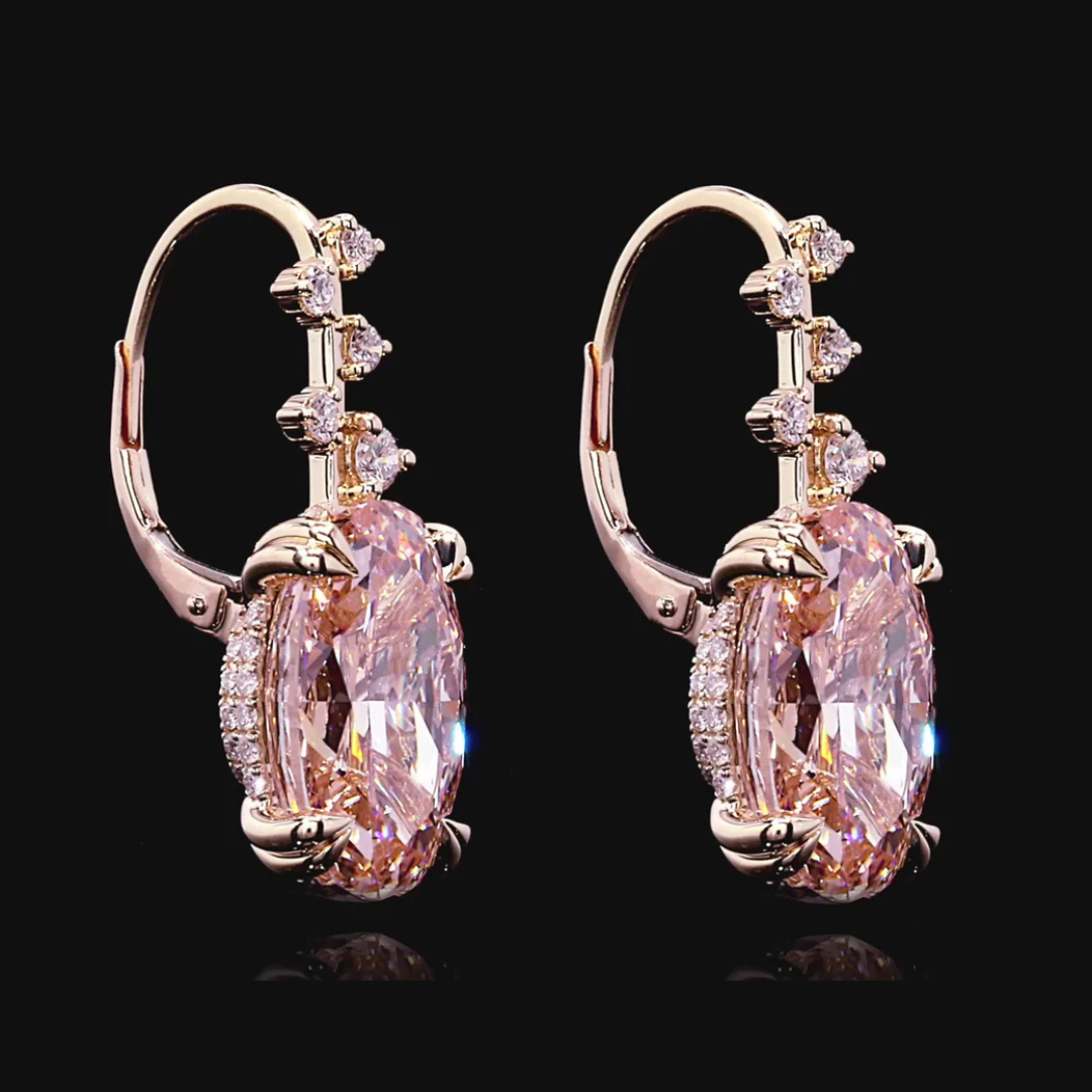 Elevate your collection with these exquisite high jewelry earrings, crafted in 18k rose gold to complement the warmth of premium pink diamonds. Featuring 82 stones totaling approximately 17.38 carats, this pair combines oval and round brilliant cuts for dynamic sparkle and refined elegance. Each stone meets exceptional standards—FIP/VS1 and F+/VS1+ clarity grades ensure lasting brilliance. Secured with reliable latch backs for everyday luxury wear. A timeless investment piece that captures light and admirat