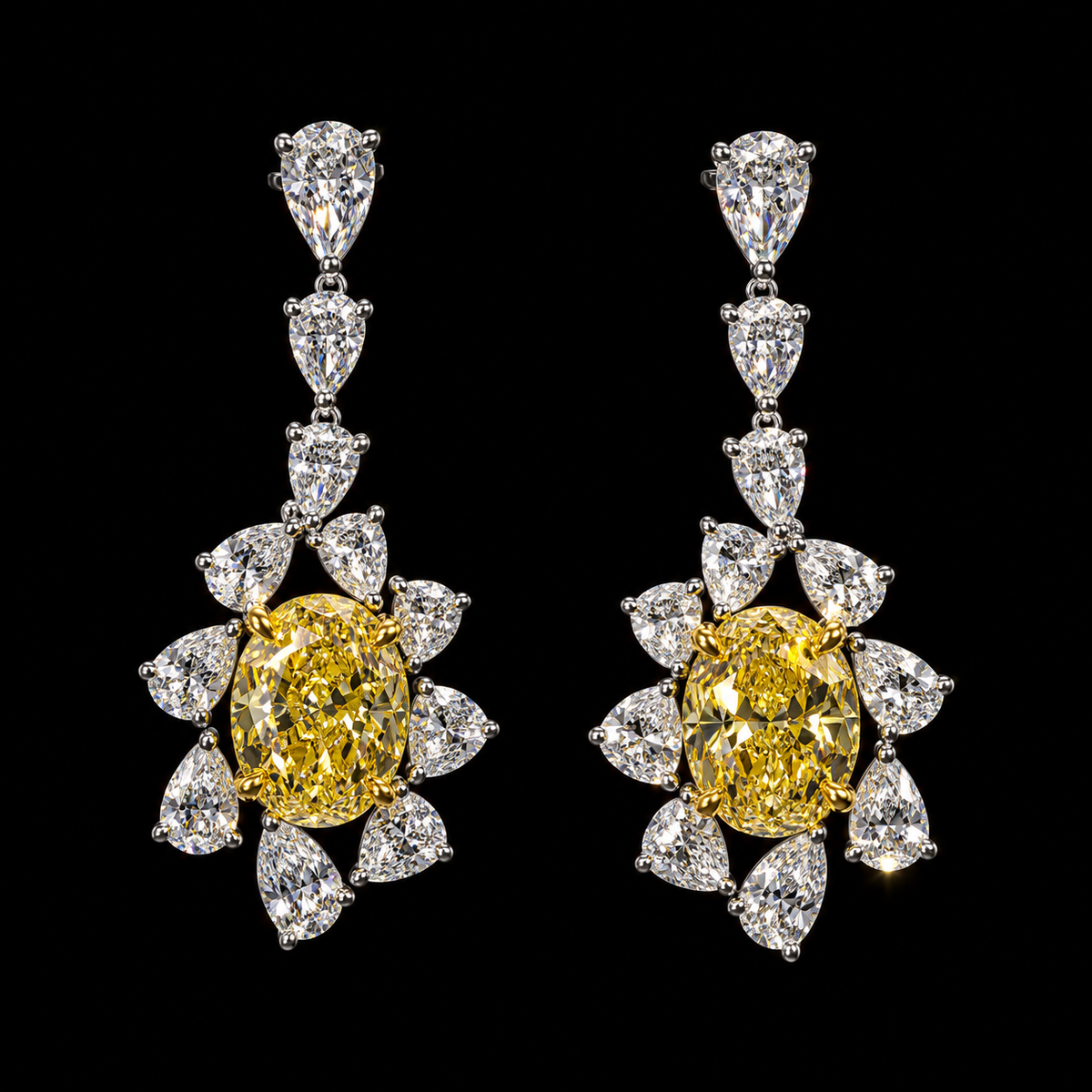 Oval yellow and pear diamond earrings featuring 2.25 carat yellow diamonds in each earring and 8.50 carats total diamond weight