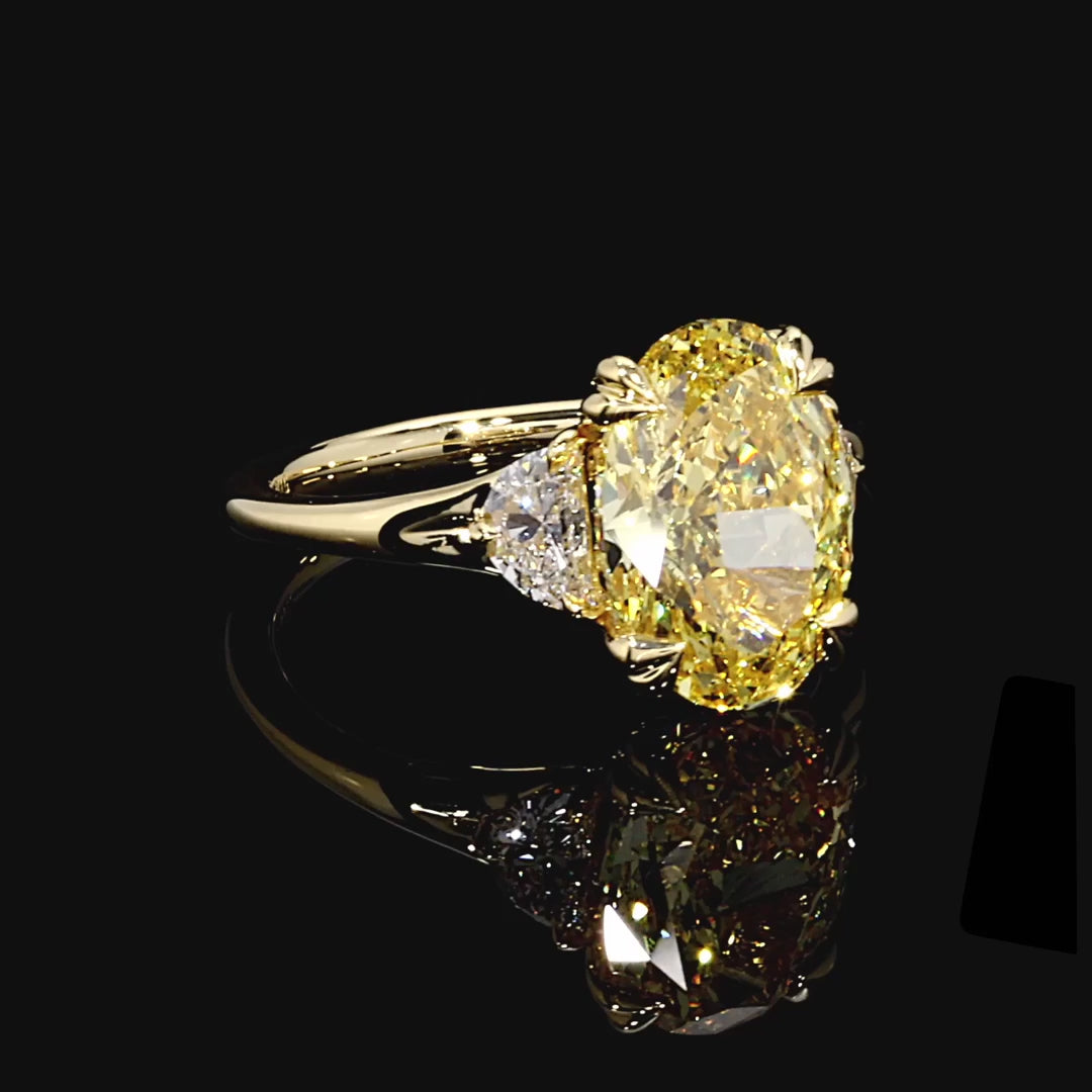 OVAL CUT YELLOW DIAMOND THREE STONE RING